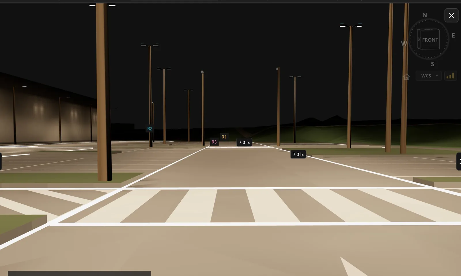Driver view along a car park aisle at night